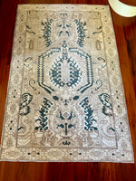measurements: 4'8" x 7'2.5"  Palette includes deep teal, taupe, tan and sand.  Vintage Turkish rug from Anatolia, handmade c.1970.&nbsp;