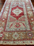 Dimensions: 3'6" x 5'7"  Palette includes pistachio, mint, bronze, ecru and ruby.  Vintage Turkish Anatolian rug c.1970, hand knotted of wool.&nbsp;  This rug is not symmetrical, as you can see from the photos. The length measurement is at the longest point. The beauty of a hand made rug!&nbsp;