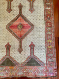 Measures 4'2.5" x 10'5"  Palette includes rouge, off-white, peanut, brown, orange and yellow.  Vintage Turkish rug c.1960, handmade of wool.   Such a unique textile! Low pile and very soft to the touch. 