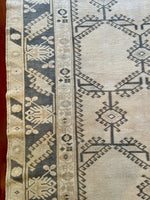 Measures 5'4.5" x 9'9.5"  Palette includes steel blue, ivory and cloud grey.   Vintage Turkish area rug c.1960, handmade of wool.  Low pile, sturdy and soft to the touch. 