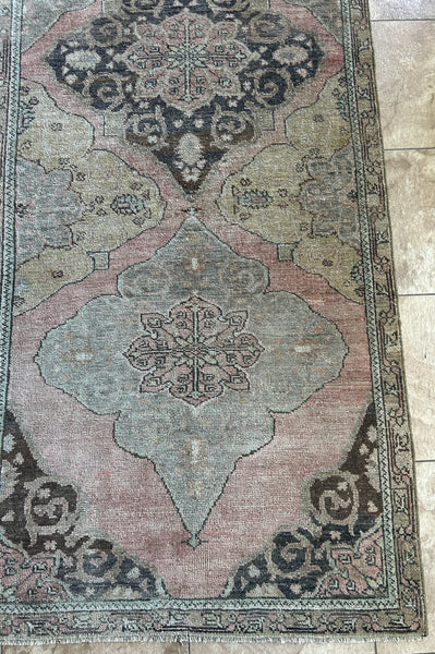 <p>Dimensions: 3'8.5" x 11'10"</p> <p>Palette includes muted rouge, sage, pistachio, slate blue, mocha, butter, electric blue.</p> <p>This runner is hand knotted of wool, it has a low pile, drapery feel.&nbsp;</p> <p>Vintage Turkish c.1970</p>