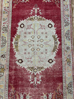 <p>Dimensions: 3'3.5" x 6'4.5"</p> <p>Palette includes raspberry, pistachio, canary, and mocha</p> <p>Vintage Turkish c.1970, low pile, hand knotted of wool.&nbsp;</p>