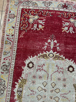 <p>Dimensions: 3'3.5" x 6'4.5"</p> <p>Palette includes raspberry, pistachio, canary, and mocha</p> <p>Vintage Turkish c.1970, low pile, hand knotted of wool.&nbsp;</p>