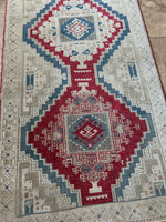 <p>Dimensions: 3' x 9'4.5"</p> <p>Palette includes ruby, sapphire, grey beige.&nbsp;</p> <p>Vintage Turkish c.1970, hand knotted of wool, soft, low pile.&nbsp;</p>