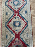 <p>Dimensions: 3' x 9'4.5"</p> <p>Palette includes ruby, sapphire, grey beige.&nbsp;</p> <p>Vintage Turkish c.1970, hand knotted of wool, soft, low pile.&nbsp;</p>