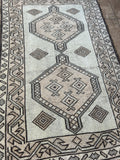 <p>Dimensions: 2’8” x 4’1"</p> <p>Palette includes chocolate, cream, nude and a light grey.</p> <p>This rug was knotted by hand using wool. Vintage Turkish Anatolian c.1970.</p>