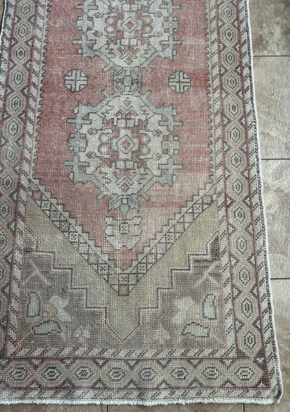 <p>Dimensions 3’2” x 9’11"</p> <p>Palette includes a soft rouge, grey, olive and soft mint.&nbsp;</p> <p>Vintage Turkish c.1970, hand knotted of wool.&nbsp;</p>