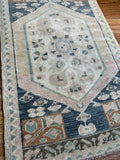 Dimensions: 1'8" x 2'9.5"  Palette includes blue, pink, ginger, saltbox and green.  Vintage Turkish c.1970. Handmade of wool. 