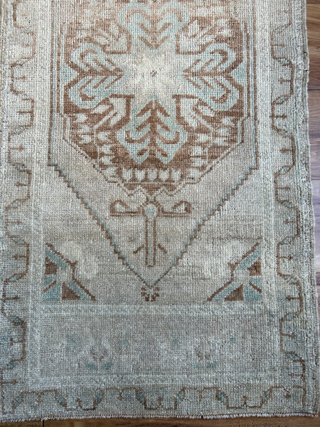 Dimensions: 1'9" x 3'7"  Palette includes blue, caramel and silvery beige.   Vintage Turkish c.1970. Handmade of wool.  
