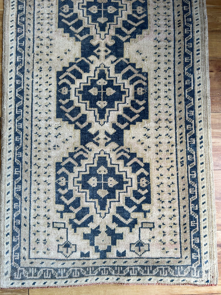 Dimensions: 1'10.5" x 3'1.5"  Palette includes navy and beige.   Vintage Turkish c.1970. Handmade of wool. 