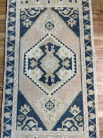 Dimensions: 1'8.5" x 3'2"  Palette includes soft pink, navy, soft sage and golden.   Vintage Turkish c.1970. Handmade of wool. 