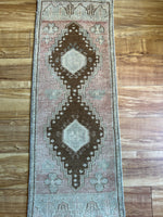 Dimensions: 1'5" at one end and narrows to 1'3.5" x 3'7"  Palette includes soft rosewood, grey/blue, and pecan.   Vintage Turkish c.1970. Handmade of wool. 