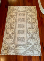 Dimensions: 3'10.5" x 6'2.5"  Palette includes soft pink undertones, wheat, and walnut.   A hand woven vintage Turkish rug c.1970. Low pile, wool. 