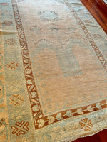 Dimensions: 3'9" x 6'7.5"  Palette includes bright blue, cinnamon, nude, and walnut.   Vintage Turkish Area Rug c.1970. Hand woven of wool. Very low pile, lightweight. 