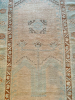 Dimensions: 3'9" x 6'7.5"  Palette includes bright blue, cinnamon, nude, and walnut.   Vintage Turkish Area Rug c.1970. Hand woven of wool. Very low pile, lightweight. 