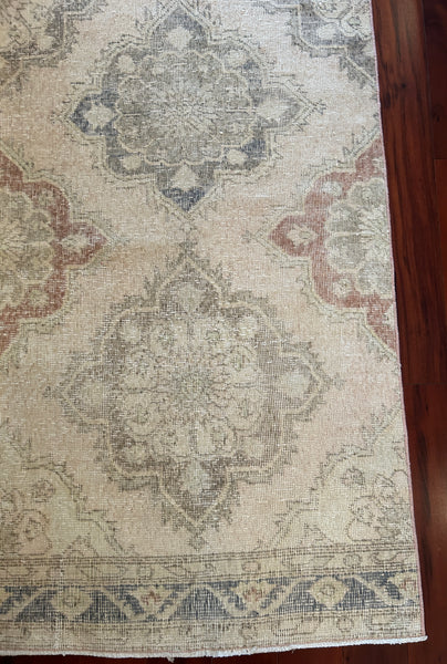 Dimensions: 2'12" x 12'3.5"  Palette includes a soft rosewood, olive, steel blue, baby pink, sage, and ecru.   Vintage Turkish area rug c.1970. Hand woven of wool. Sturdy. 