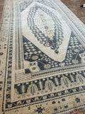 Dimensions: 4'5" x 9'1.5"  Palette includes navy, gray and wheat.  This is a vintage Turkish rug c.1960. Woven by hand of wool.   This size is great for an entryway, kitchen, bathroom, or at the foot of a bed! 