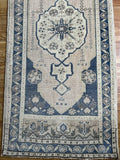 Dimensions: 1'11.5" x 4'2.5"  Palette includes navy, taupe, wheat, and a soft pink tone.  Vintage Turkish c.1960, handmade of wool. 