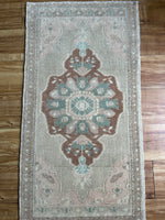 Dimensions: 1'8.5" x 3'3"  Palette includes soft salmon, rosewood, teal and moonstone.  Vintage Turkish c.1960, handmade of wool. 