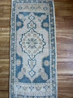 Dimensions: 1'7.5 x 3'7  Palette includes blue tan and flaxen.  Vintage Turkish c.1970, handknotted of wool. 