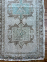 Dimensions: 1'8.5 x 3'6.5  Palette includes electric blue, cream, brown, and green undertones.   Vintage Turkish c.1970, hand knotted of wool.