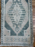 Dimensions: 1'9.5 x 3'6.5  Palette includes steel blue and nude.   Vintage Turkish c.1970, hand knotted of wool. 
