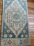 Dimensions: 1'7 x 3'5  Palette includes steel blue, mustard, coffee, tan and gray.  Vintage Turkish c.1970, hand knotted of wool. 
