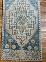 Dimensions: 1'7 x 3'5  Palette includes steel blue, mustard, coffee, tan and gray.  Vintage Turkish c.1970, hand knotted of wool. 