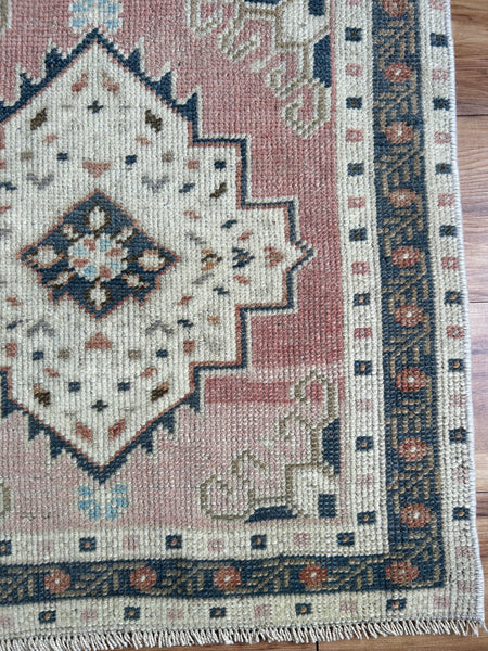 Dimensions: 1'10.5" x 2'1"  Palette includes rouge, royal, bronze and cream.   Vintage Turkish c.1970, hand knotted of wool. 