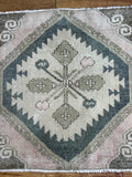 Dimensions: 2'4.5" x 2'2"  soft pink, pine, moss and buff.  Vintage Turkish c.1970, handmade of wool. 