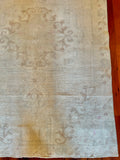 Measures 4'6.5" x 7.5'  Palette includes steel blue, pops of pink, cinnamon, and beige  Vintage Turkish rug approximately 60 years old, handmade of wool 