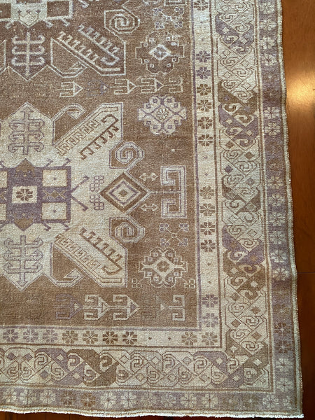 Dimensions: 4'3" x 6'8"  Palette includes brown, light brown and a grayish purple.   Turkish approximately 60 years old. Low pile, sturdy.   Rug pad recommended.   Spot clean using mild dish soap and the blotting technique.